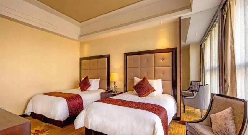 Bed in New Century Grand Hotel Xinxiang
