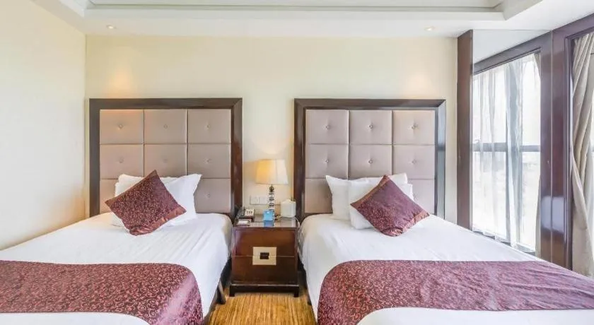 Bed in New Century Grand Hotel Xinxiang