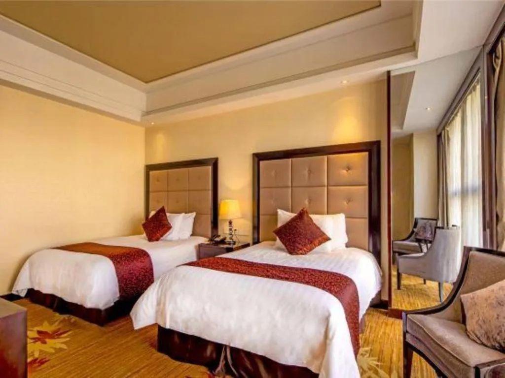 Bed in New Century Grand Hotel Xinxiang