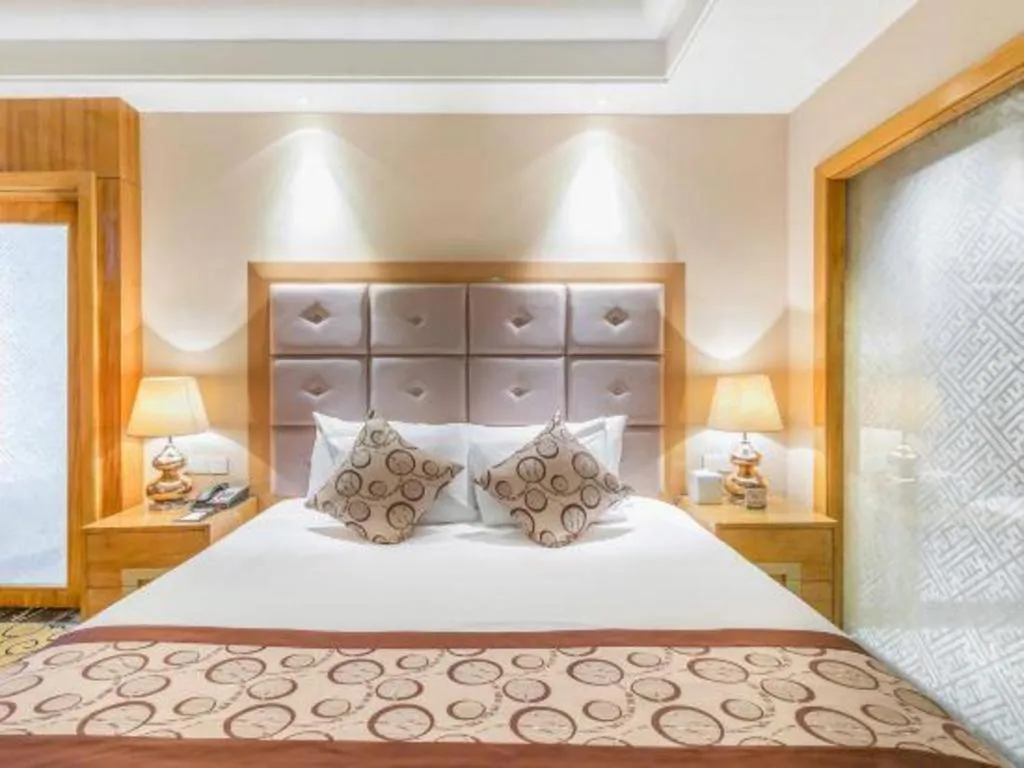 Bed in New Century Grand Hotel Xinxiang