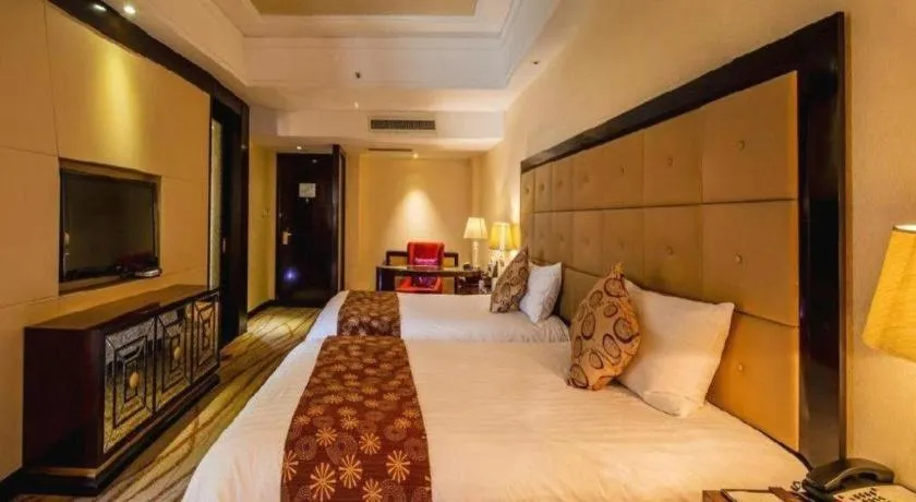 Bed in New Century Grand Hotel Xinxiang