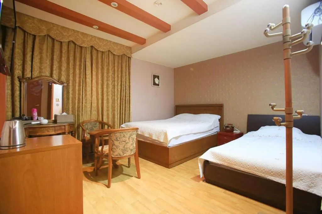 Bed in Monaco Hotel Jeju