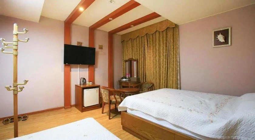 Bed in Monaco Hotel Jeju