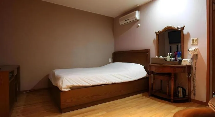 Bed in Monaco Hotel Jeju