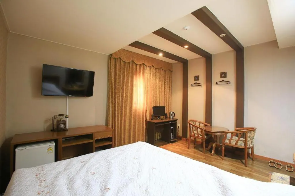 Bed in Monaco Hotel Jeju