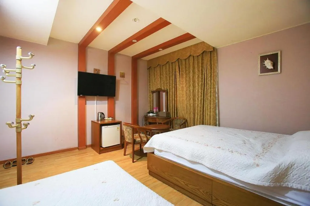 Bed in Monaco Hotel Jeju