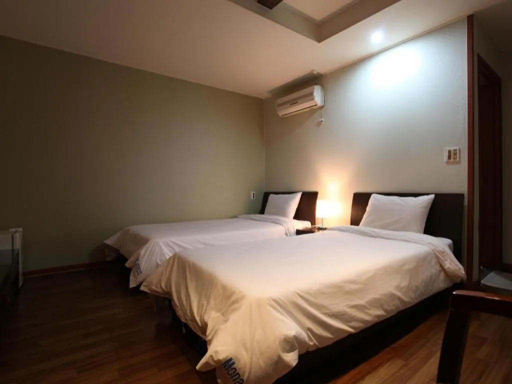 Bed in Monaco Hotel Jeju
