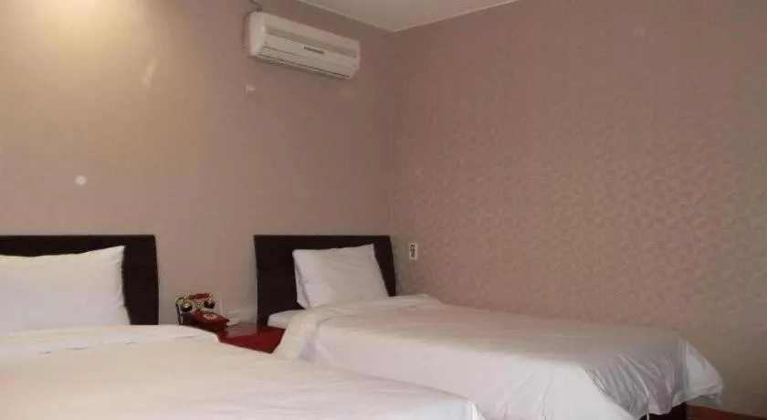 Bed in Monaco Hotel Jeju