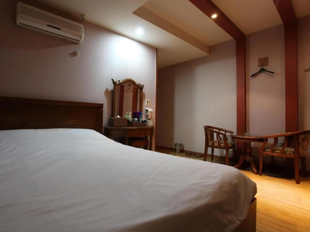 Bed in Monaco Hotel Jeju