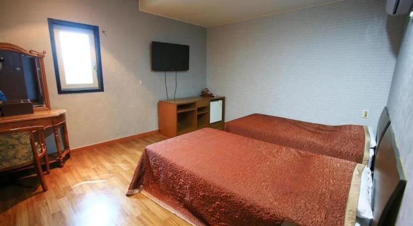 Bed in Monaco Hotel Jeju