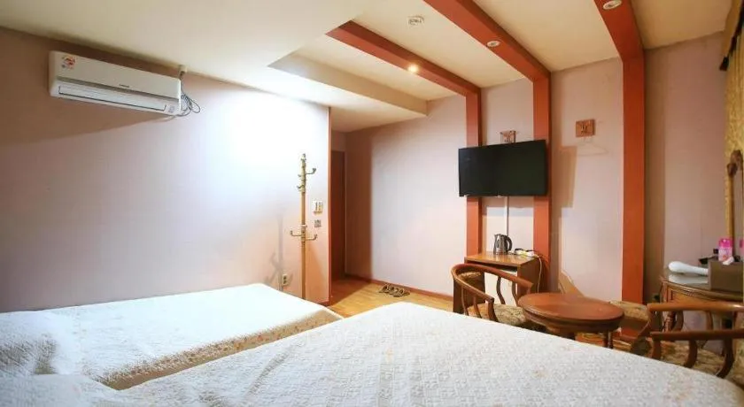 Bed in Monaco Hotel Jeju