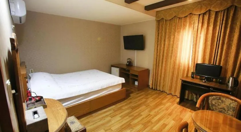 Bed in Monaco Hotel Jeju