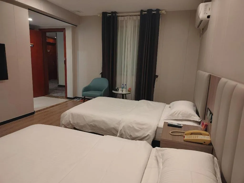 Bed in GreenTree Inn Shenzhen Kengzi Town Express Hotel