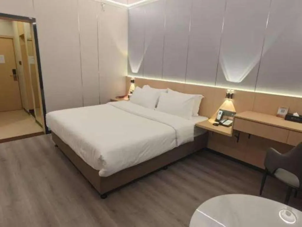 Bed in Zhenxing Hotel