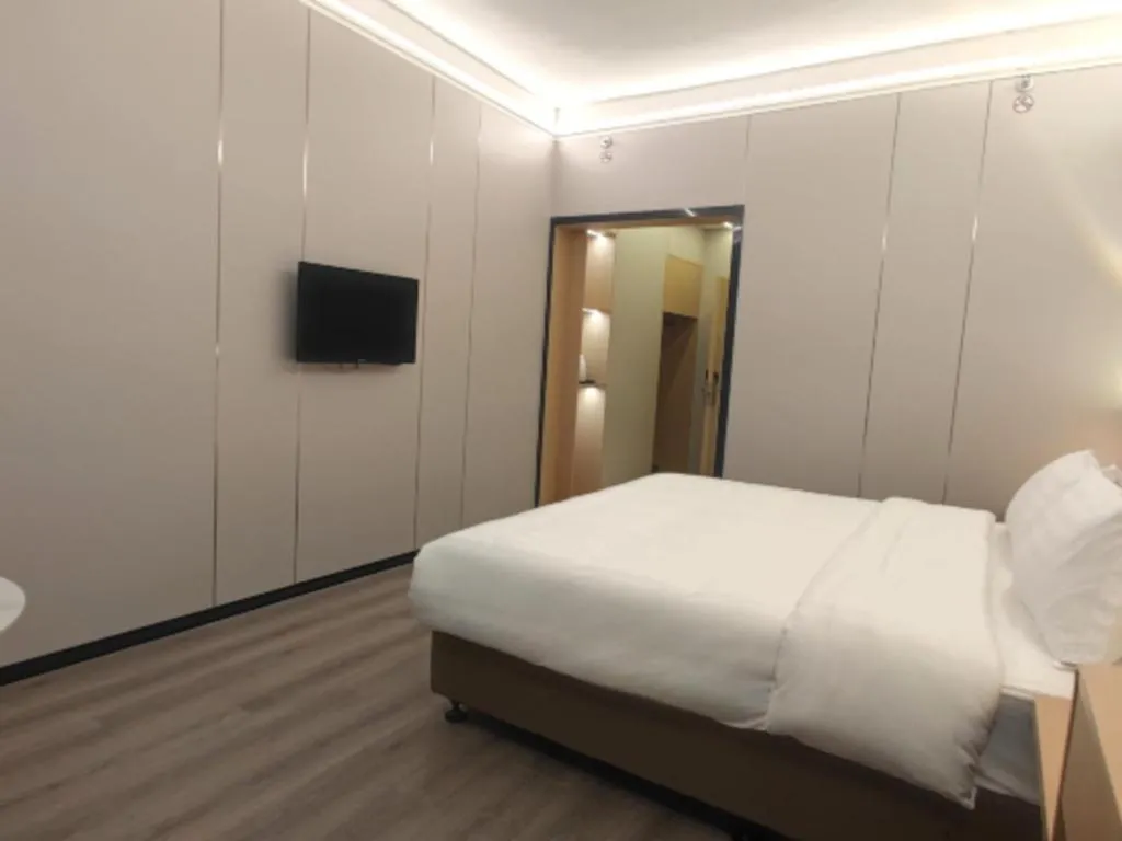 Bed in Zhenxing Hotel