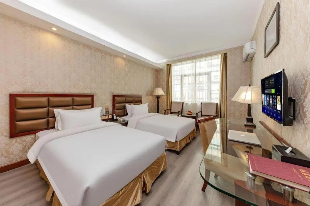 Bed in Zhenxing Hotel