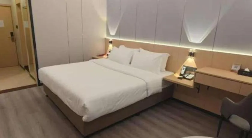 Bed in Zhenxing Hotel