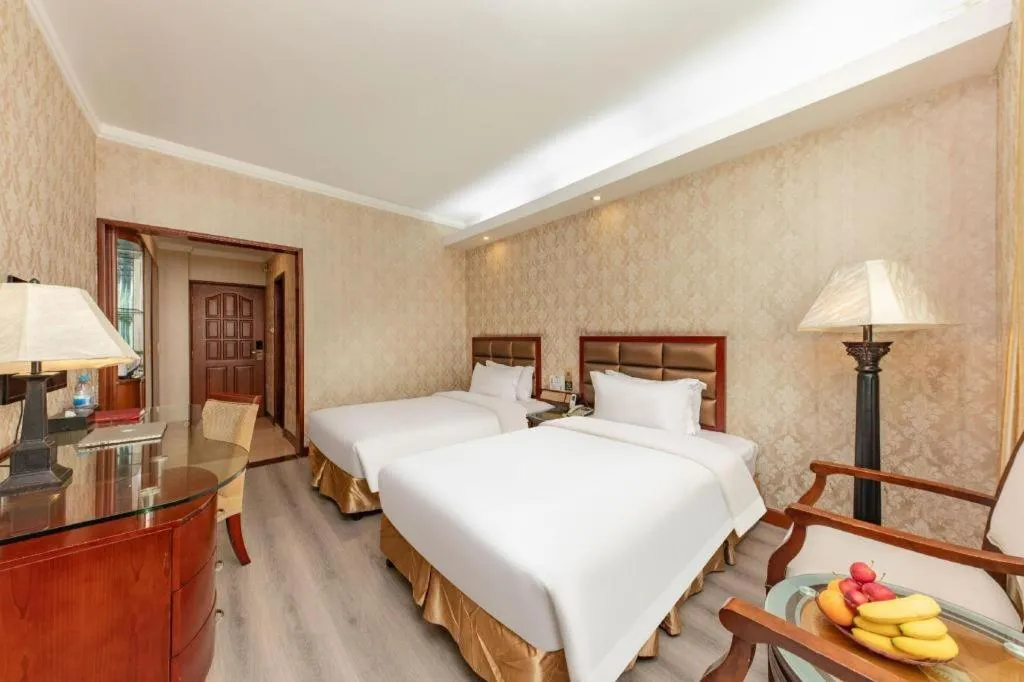 Bed in Zhenxing Hotel