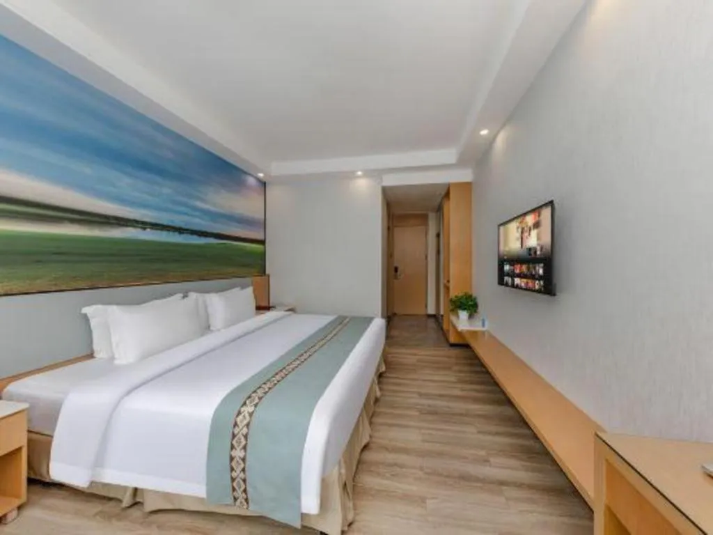 Bed in Zhenxing Hotel