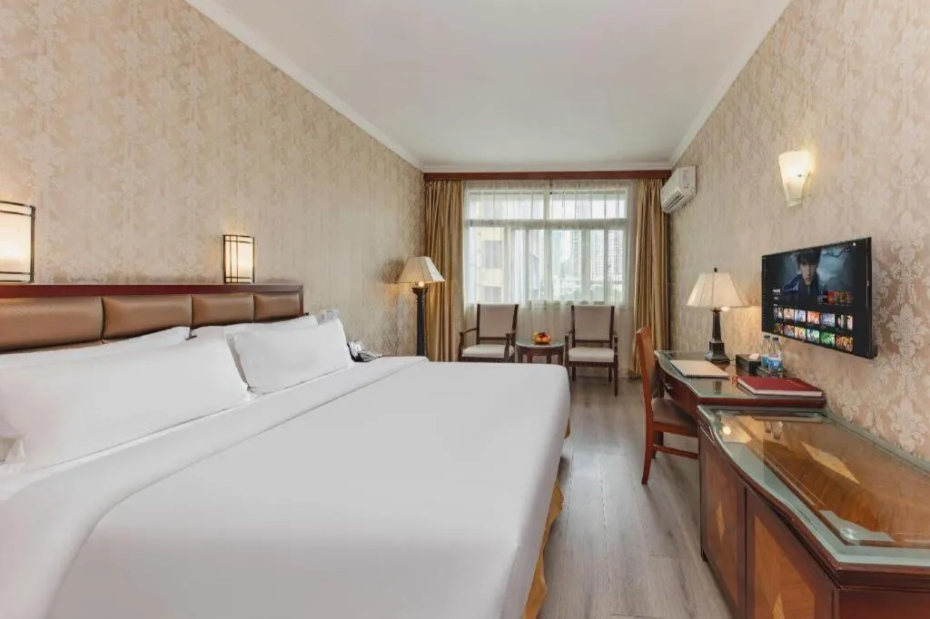 Bed in Zhenxing Hotel