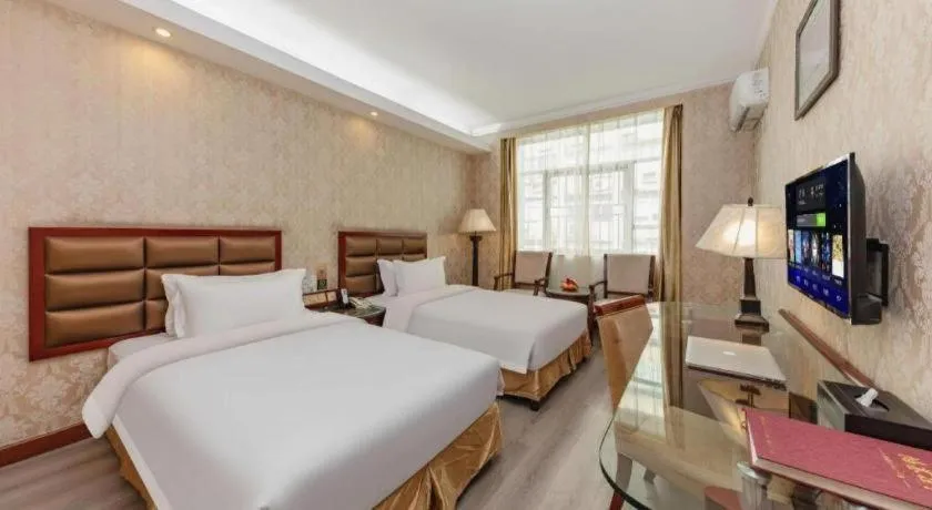 Bed in Zhenxing Hotel