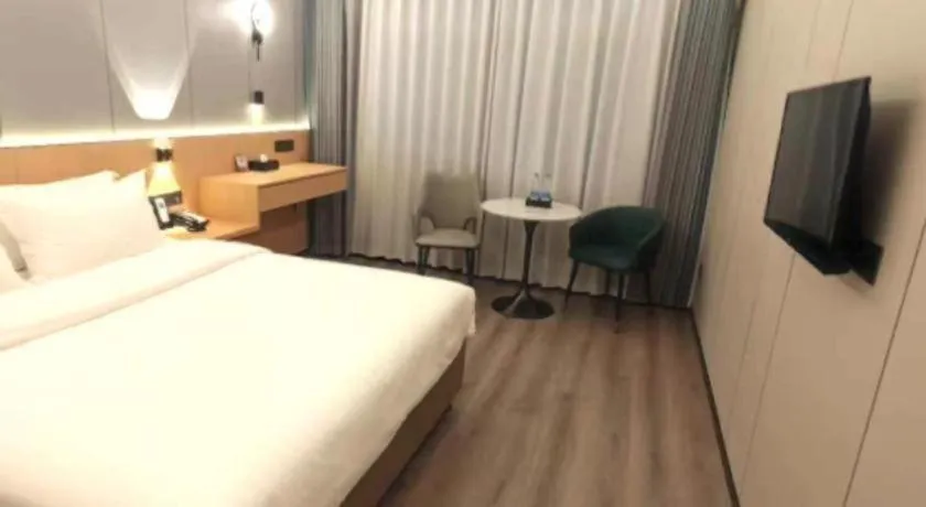 Bed in Zhenxing Hotel