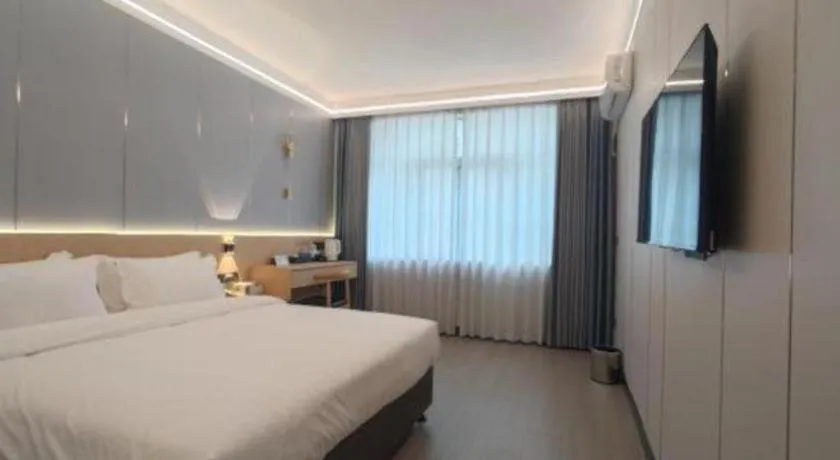 Bed in Zhenxing Hotel