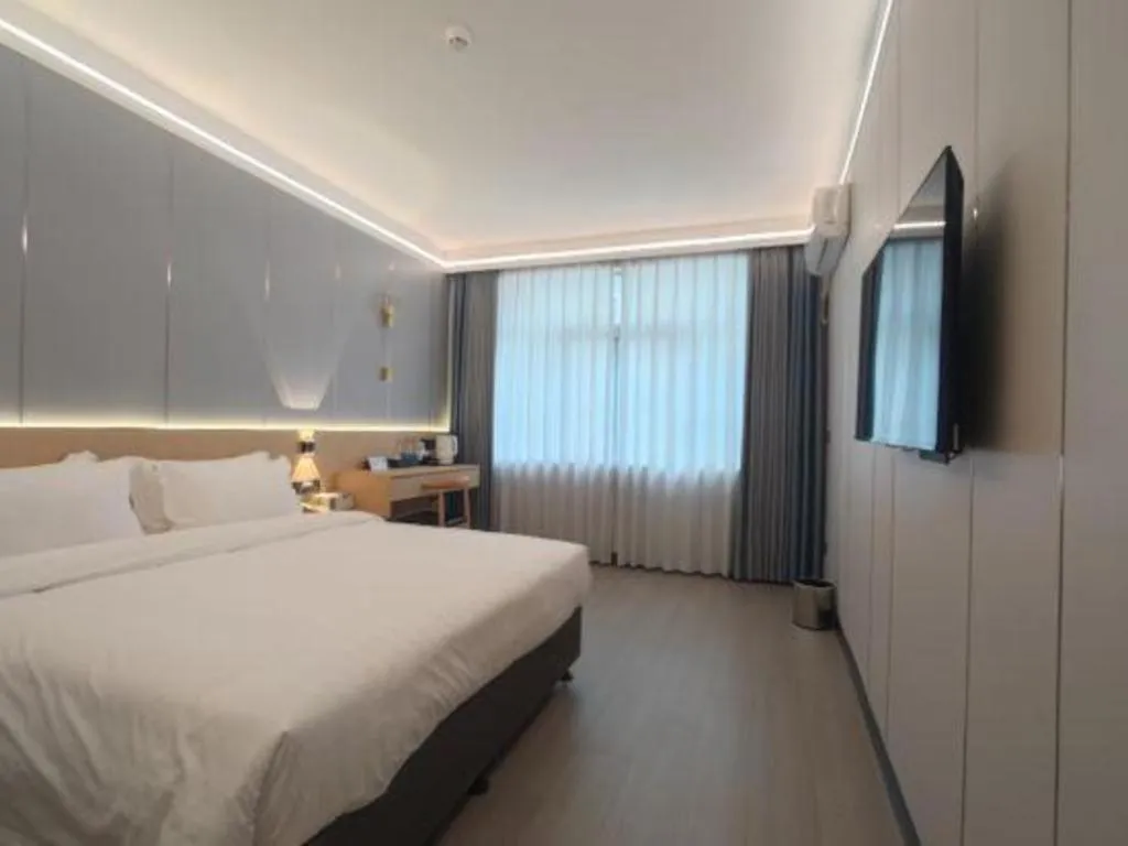 Bed in Zhenxing Hotel