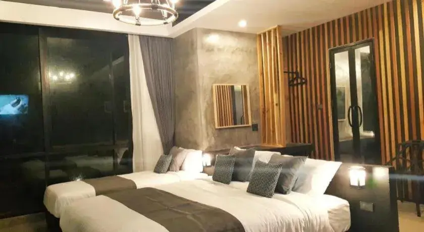 Bed in Baan Chao Mai Beach House Bed in Baan Chao Mai Beach House