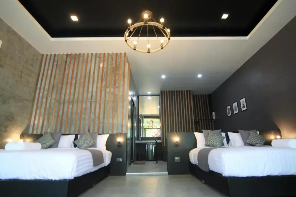 Bed in Baan Chao Mai Beach House Bed in Baan Chao Mai Beach House