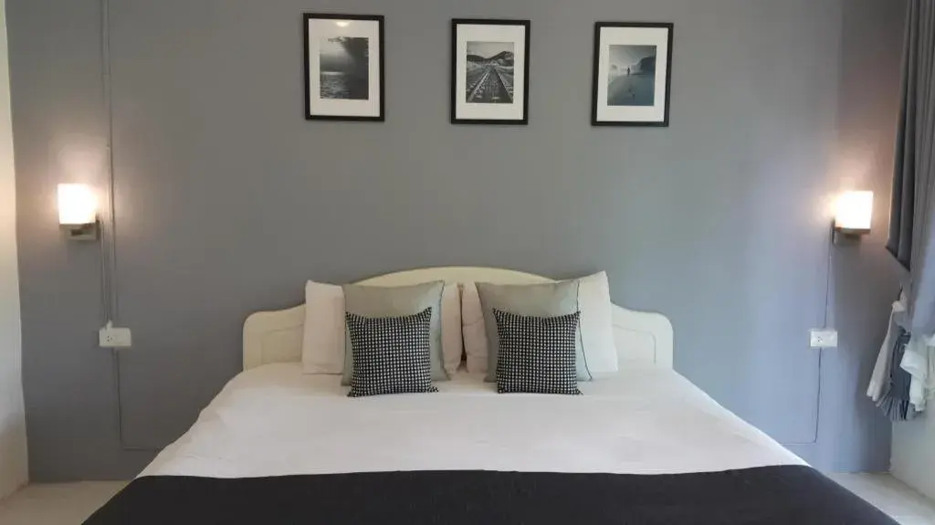 Bed in Baan Chao Mai Beach House Bed in Baan Chao Mai Beach House