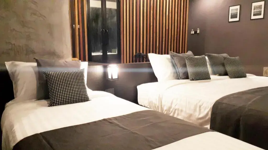 Bed in Baan Chao Mai Beach House Bed in Baan Chao Mai Beach House