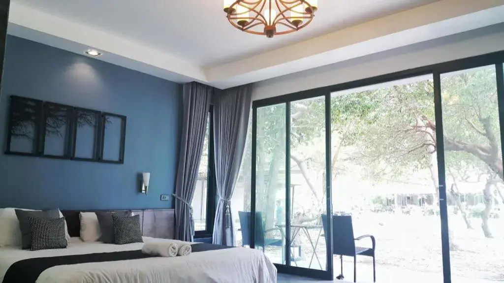 Bed in Baan Chao Mai Beach House Bed in Baan Chao Mai Beach House