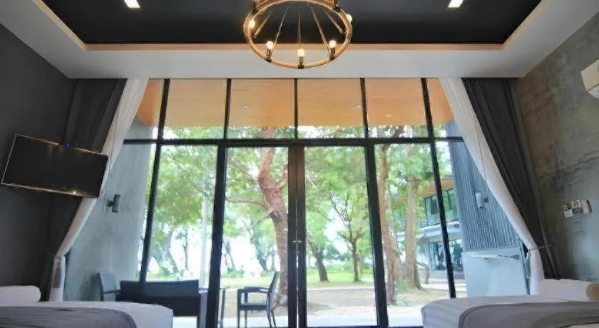 Bed in Baan Chao Mai Beach House