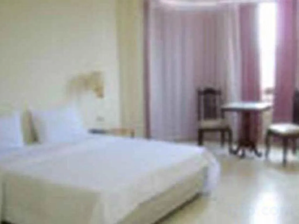 Bed in The Majestic Sakon Nakhon Hotel