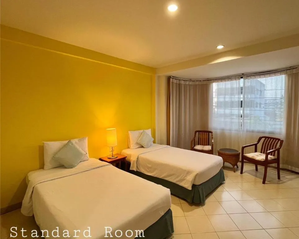 Bed in The Majestic Sakon Nakhon Hotel