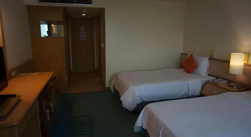 Bed in The Majestic Sakon Nakhon Hotel