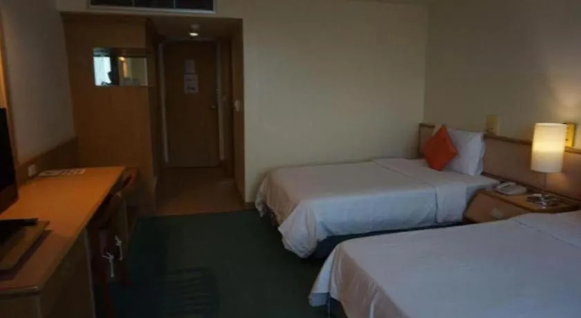 Bed in The Majestic Sakon Nakhon Hotel