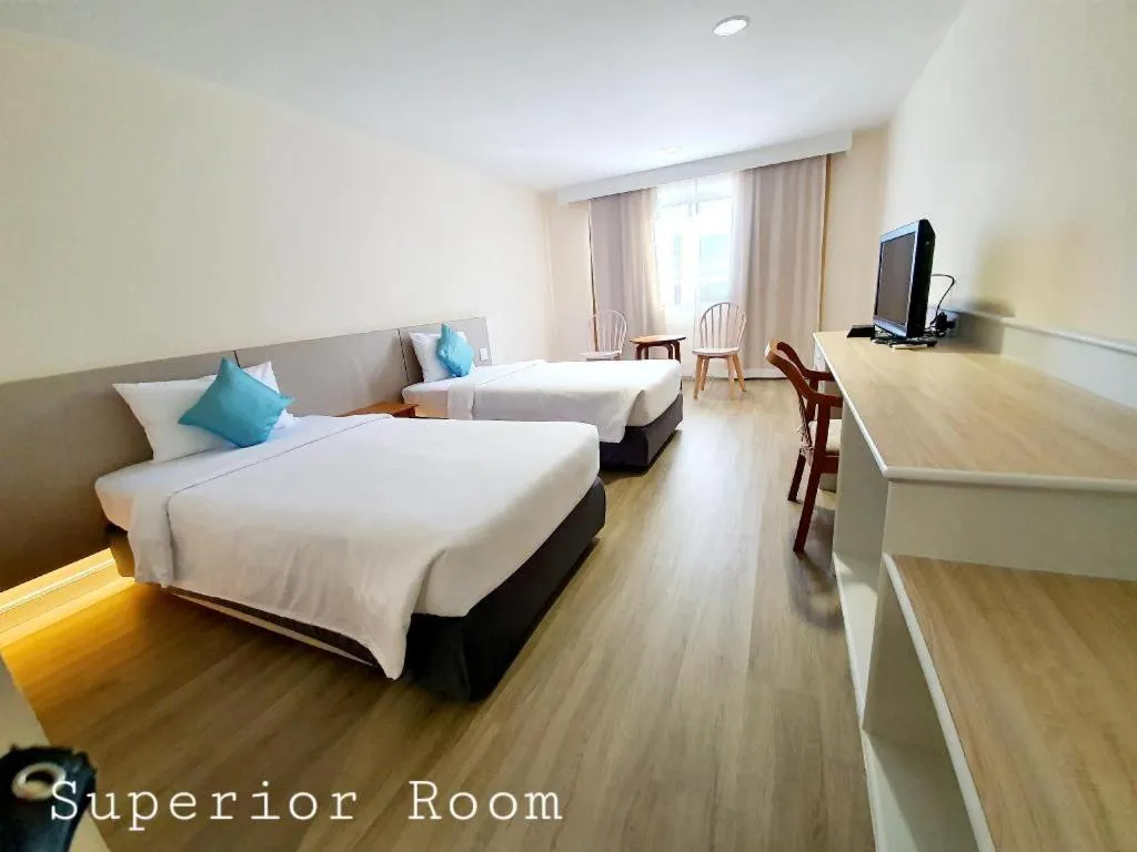 Bed in The Majestic Sakon Nakhon Hotel