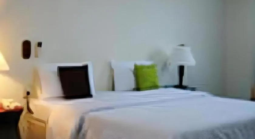 Bed in The Majestic Sakon Nakhon Hotel