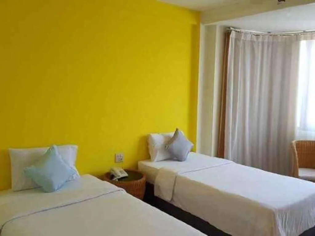 Bed in The Majestic Sakon Nakhon Hotel