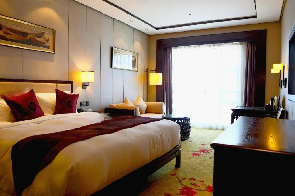 Bed in Xiang Yun Sha Garden Hotel