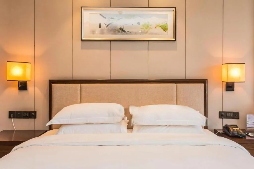 Bed in Xiang Yun Sha Garden Hotel