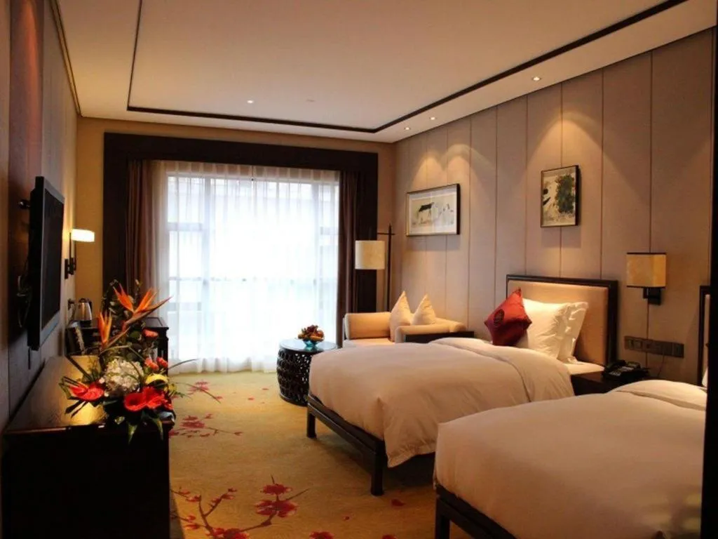 Bed in Xiang Yun Sha Garden Hotel