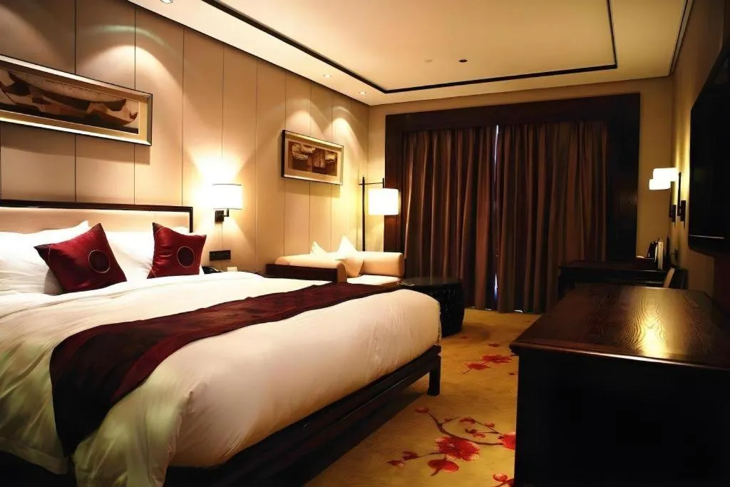 Bed in Xiang Yun Sha Garden Hotel