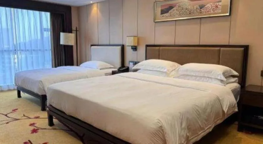 Bed in Xiang Yun Sha Garden Hotel