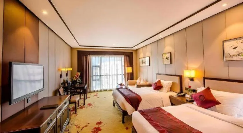Bed in Xiang Yun Sha Garden Hotel