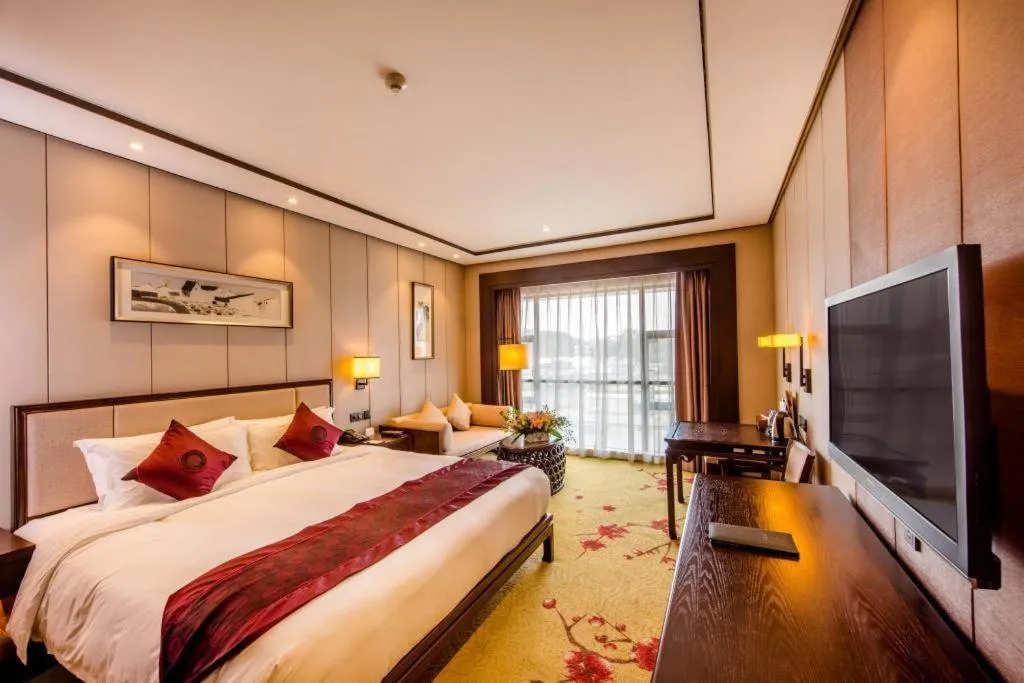 Bed in Xiang Yun Sha Garden Hotel