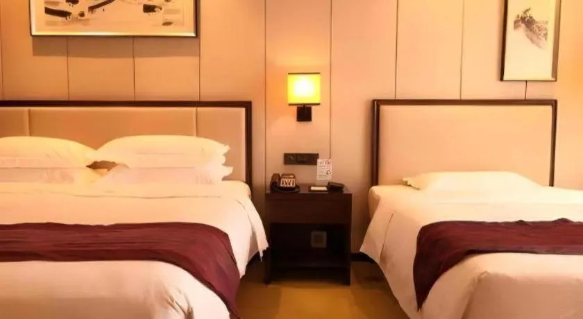 Bed in Xiang Yun Sha Garden Hotel