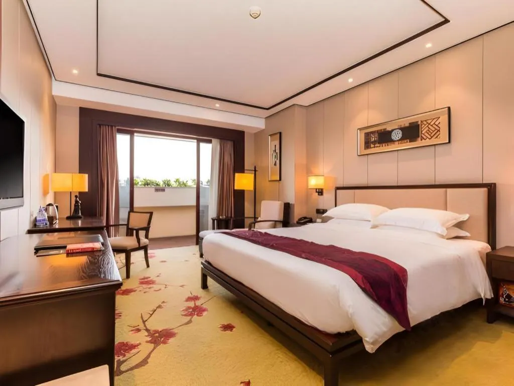 Bed in Xiang Yun Sha Garden Hotel